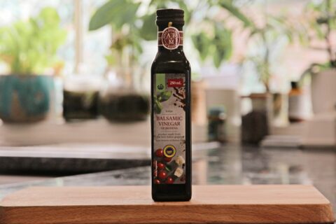 Balsamic vinegar bottle with label for authentic Italian food verification