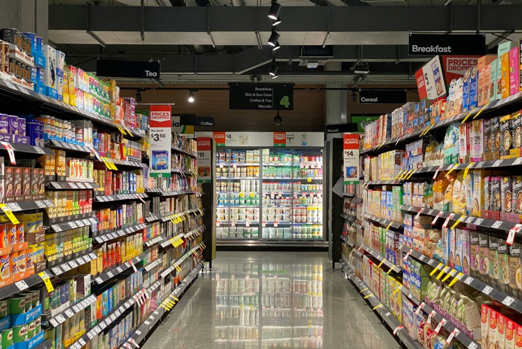 Supermarket aisle with stocked shelves for Italian food import planning