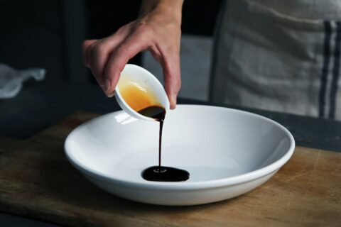 Balsamic vinegar being poured for premium Italian food profitability article
